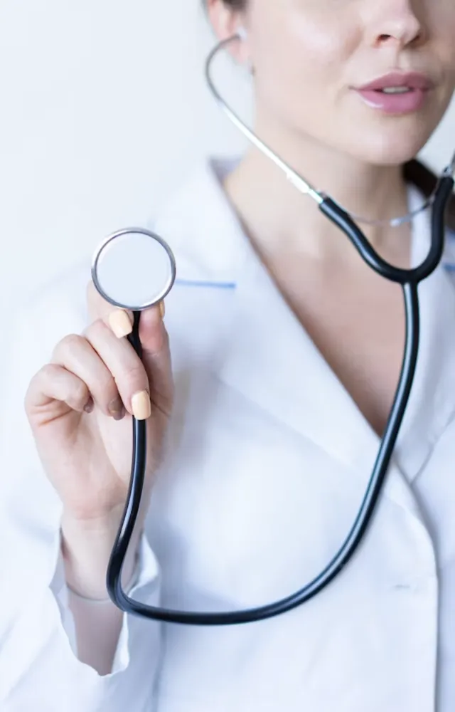 A doctor holding a stethoscope